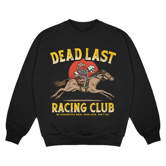 Front view of black crewneck sweater with ‘Dead Last Racing Club’ text and a skeleton cowboy riding a horse in front of a red sun
