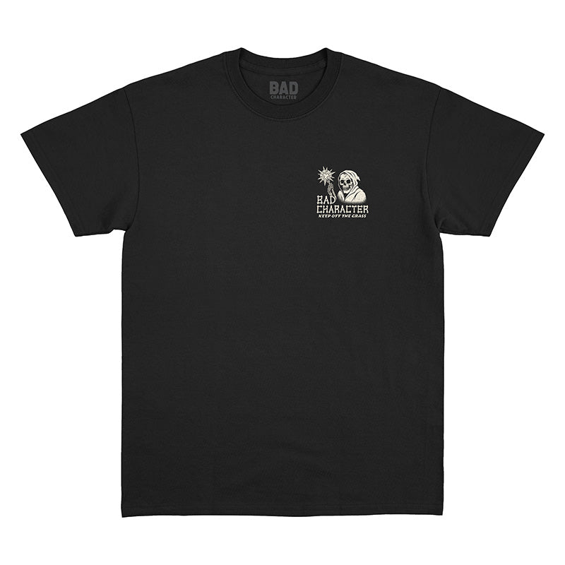 Front view of black t-shirt with small ‘Bad Character’ left chest print and ‘Keep Off the Grass’ graphic